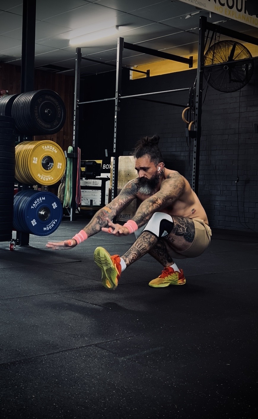 Jotik Serje performing a controlled single-leg strength movement