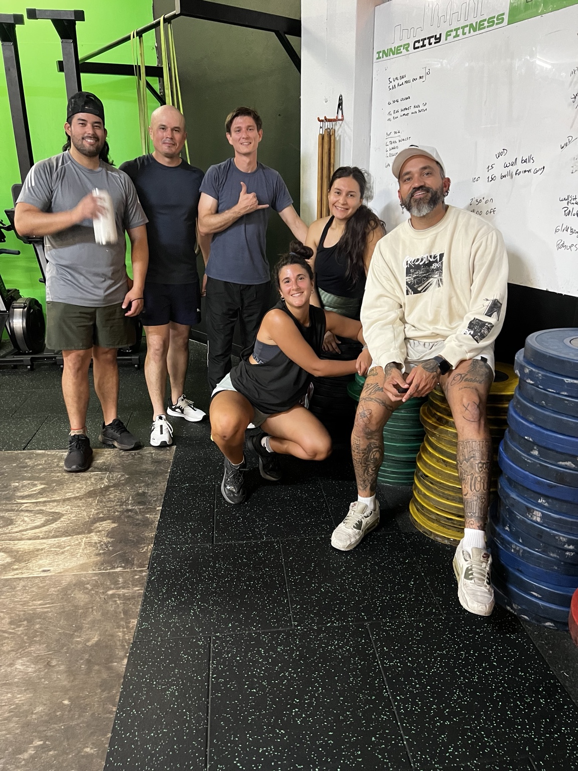 Current EZ Classes Perth members and coach together inside the gym